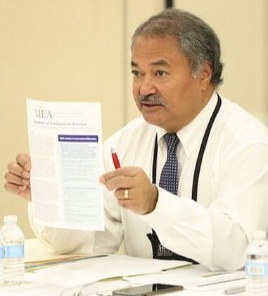 Dr. Jeet Joshee shows a copy of the AIEA Standards